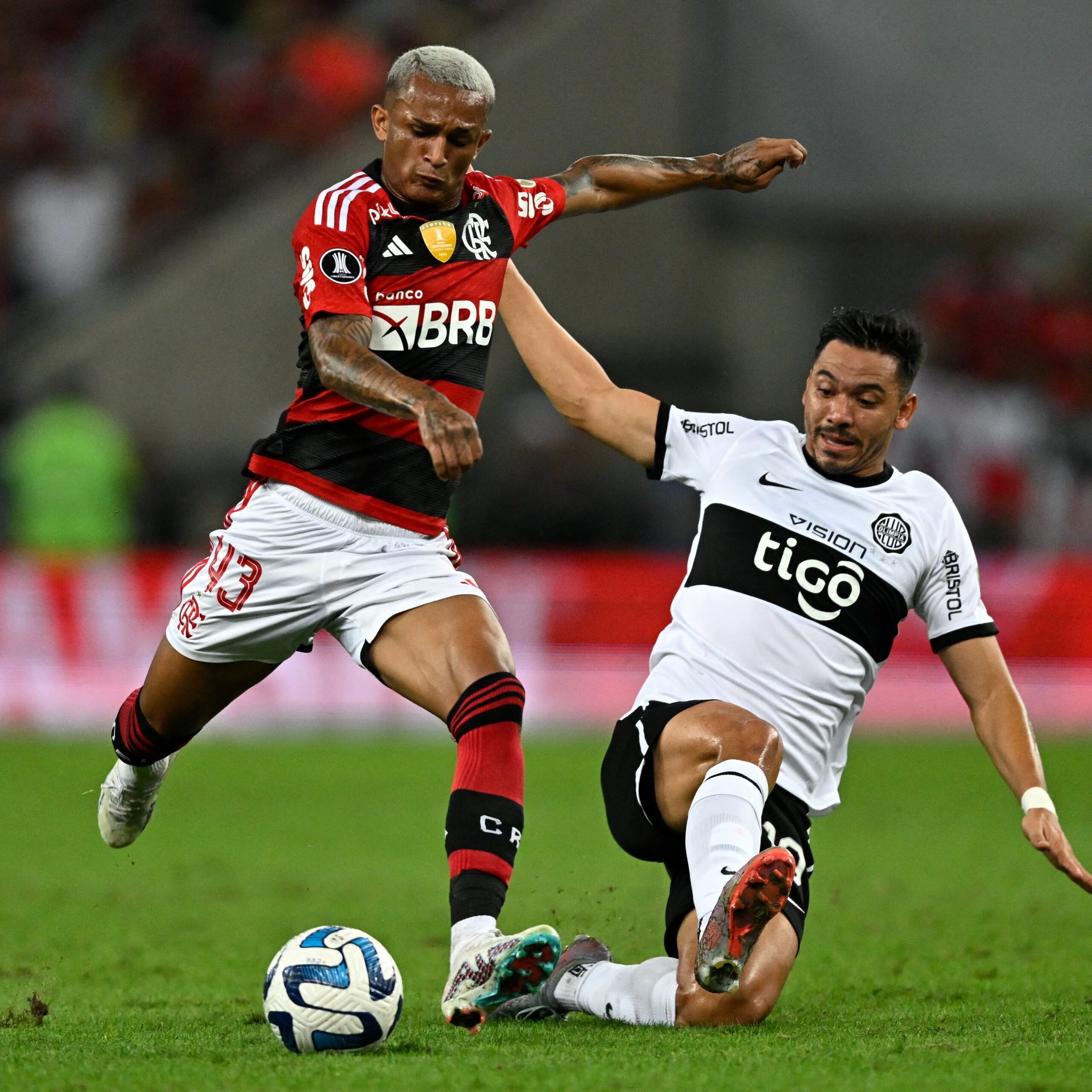 Wesley and Lucas Silva of Cruzeiro and Gerson of Flamengo fight